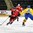 GRAND FORKS, NORTH DAKOTA - APRIL 18: Switzerland's Fabian Berni #9 skates with the puck while Sweden's Adam Thilander #8 defends during preliminary round action at the 2016 IIHF Ice Hockey U18 World Championship. (Photo by Minas Panagiotakis/HHOF-IIHF Images)

